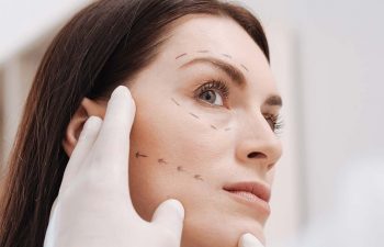 Woman Beign Examined for a Facelift NYC