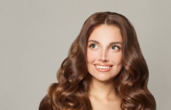 Woman with thick long dark hair.