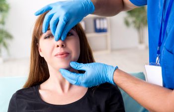 Woman during rhinoplasty plastic surgery consultation.